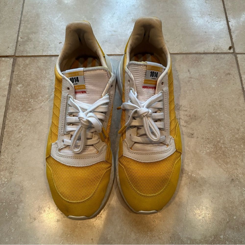Men’s Adidas ZX 500 RM shoes in yellow.